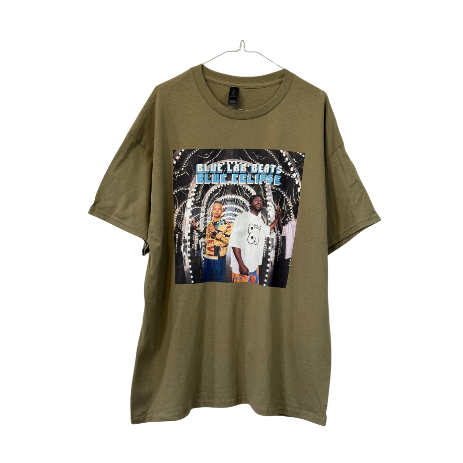 Green t-shirt with graphic design of two people and text 'Blue Lab Beats Blue Eclipse' Cover art of Blue Lab Beats forth album on white background.