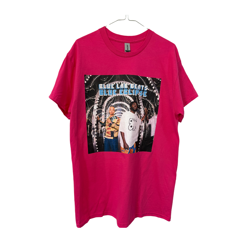Pink t-shirt with graphic design of two people and text 'Blue Lab Beats Blue Eclipse' Cover art of Blue Lab Beats forth album on white background.