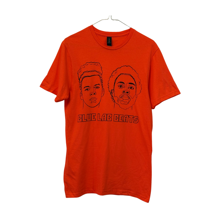 orange t-shirt with black line art faces graphic design on a white background